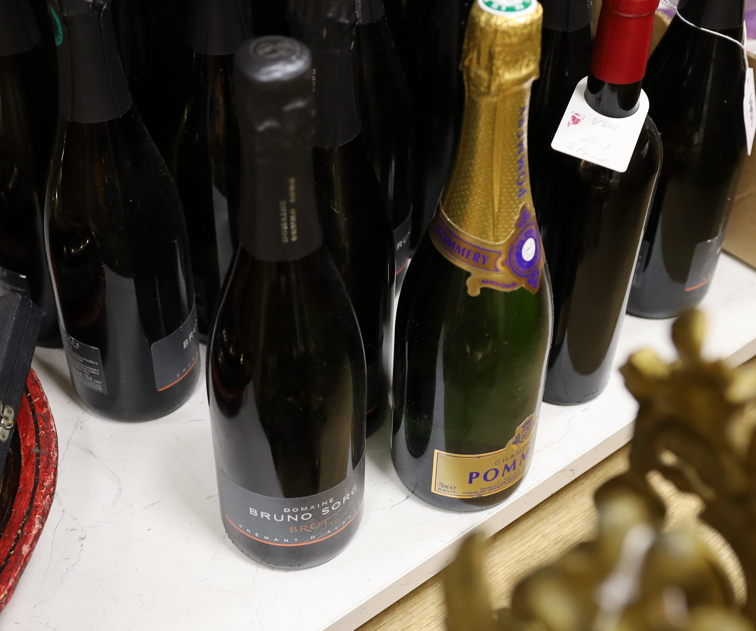 Twenty bottles of alcohol, mostly champagne including Domaine Bruno Sorg Brut and Champagne Pommery and a bottle of sparking tea